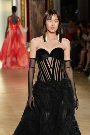 model wearing black sheer dress