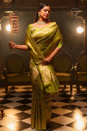 woman wearing Banarasi saree green 