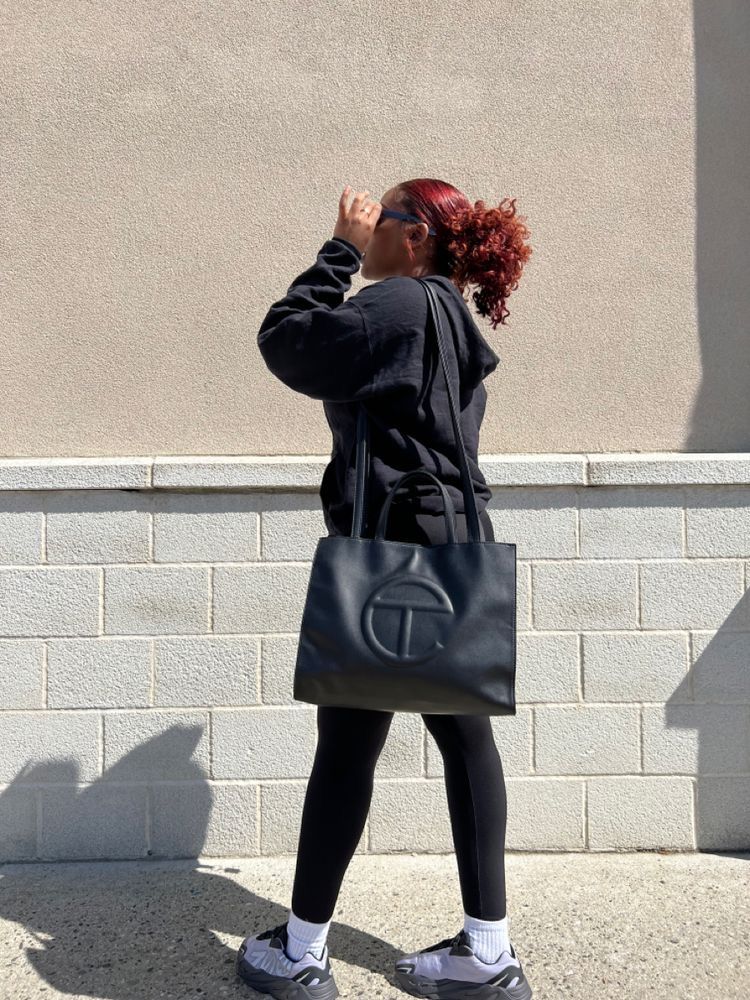 woman with big nylon bags