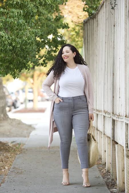 plus-sized woman in gray jeans and white Tee shirt