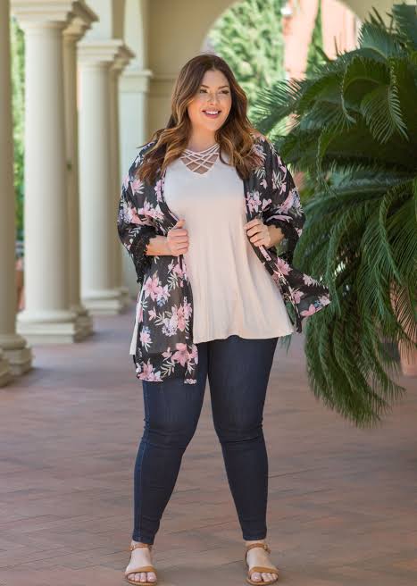 Woman in tight blue jeans with oversized shirt