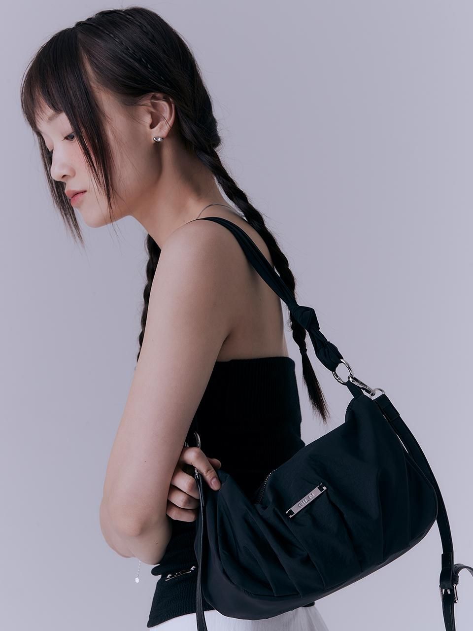 asian girl with black nylon bags