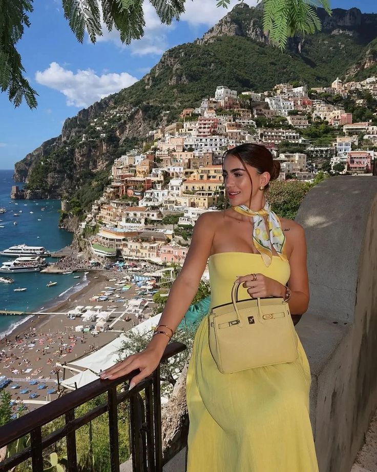 Amalfi Aesthetic woman in Italian seaside setting wearing Amalfi Aesthetic outfit with matching scarf and bag