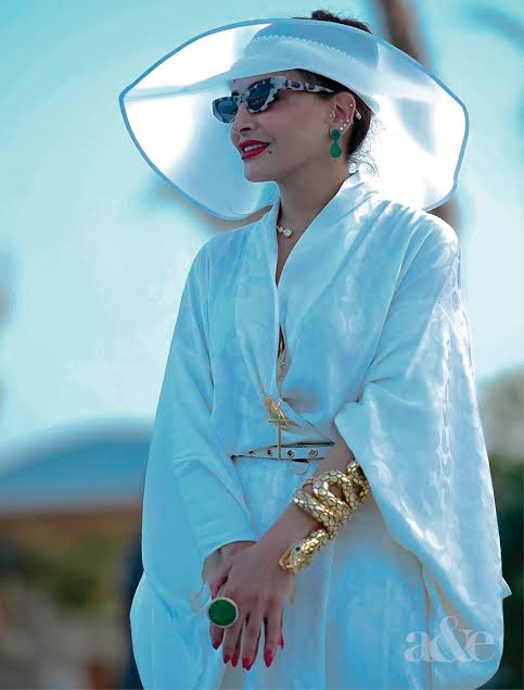 woman in white Saudi fashion outfit 