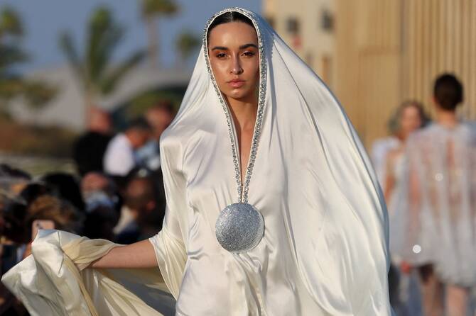 woman in white Saudi fashion outfit 