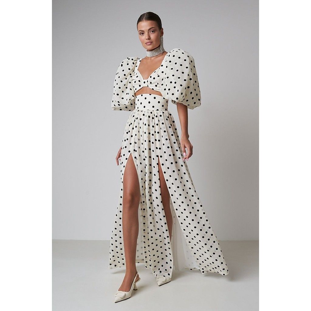 woman in peek a boo polka dot dress mixing polka dots, gingham, and checks