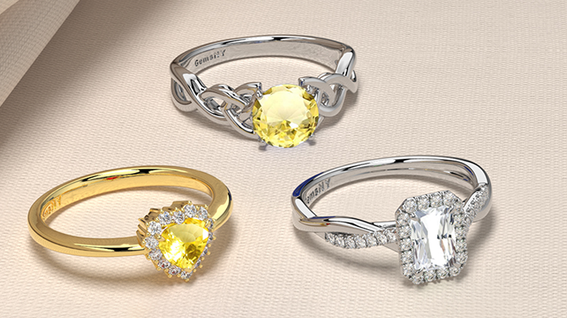 3 rings two are yellow sapphire stones