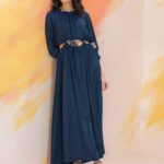 Girl in blue dress with paak a boo center