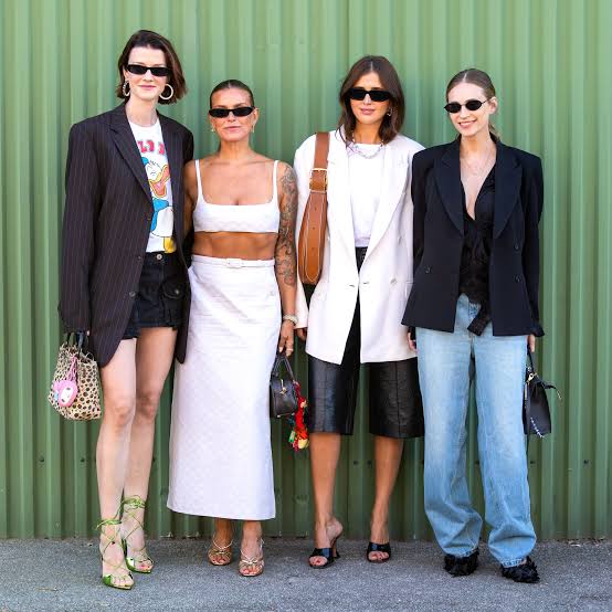 4 woman wearing sunglasses in  top fashion trends outfits
