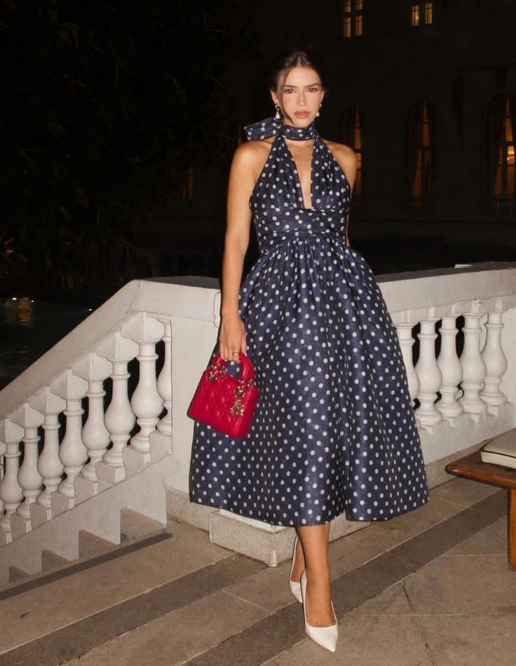 woman in dark blue Polka dots dress