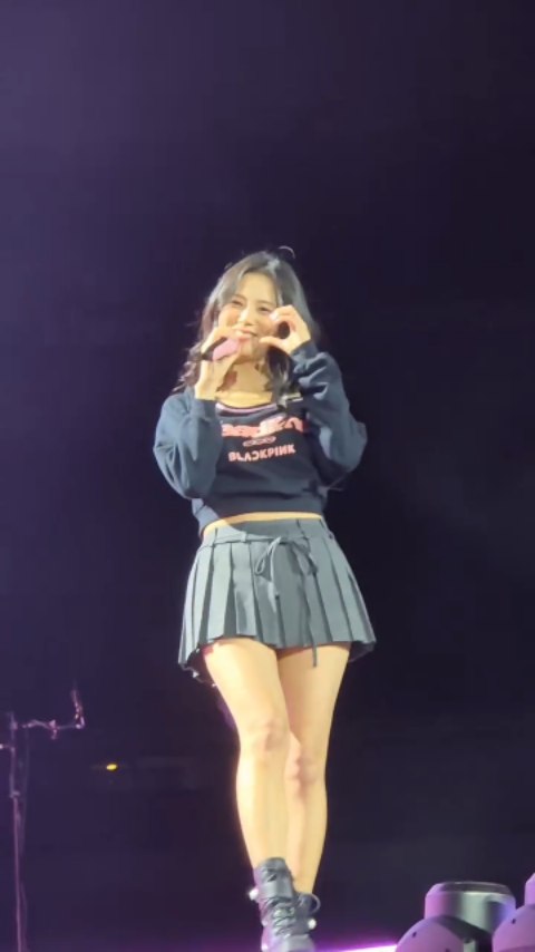 Blackpink Jisoo wore a Threetimes A-line skirt and Jimmy Choo boots.