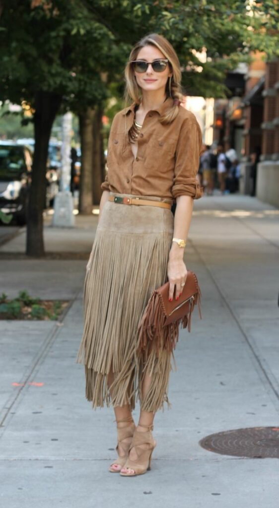 Model pairing heavy Fringe skirt with Fringe bag