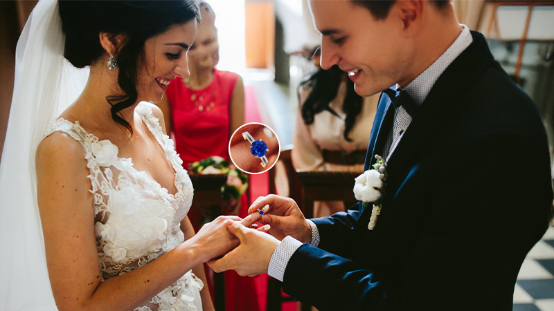 Wedding where couple is exchanging Sapphire Wedding Bands
