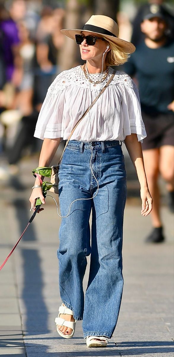 Naomi Watts in boho white top paired with denim jeans