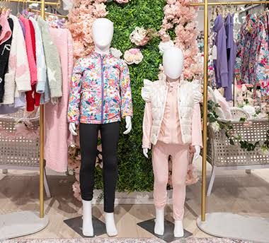 2 mannequins wearing kids apparel at the Dallas Apparel & Accessories Market