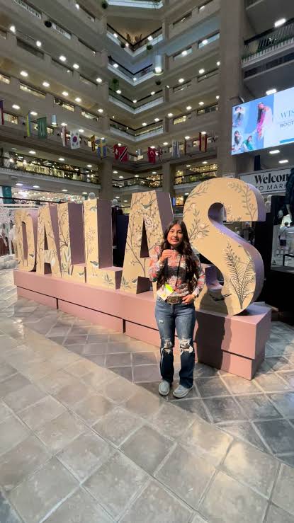 woman posing for photo at the Dallas Apparel & Accessories Market