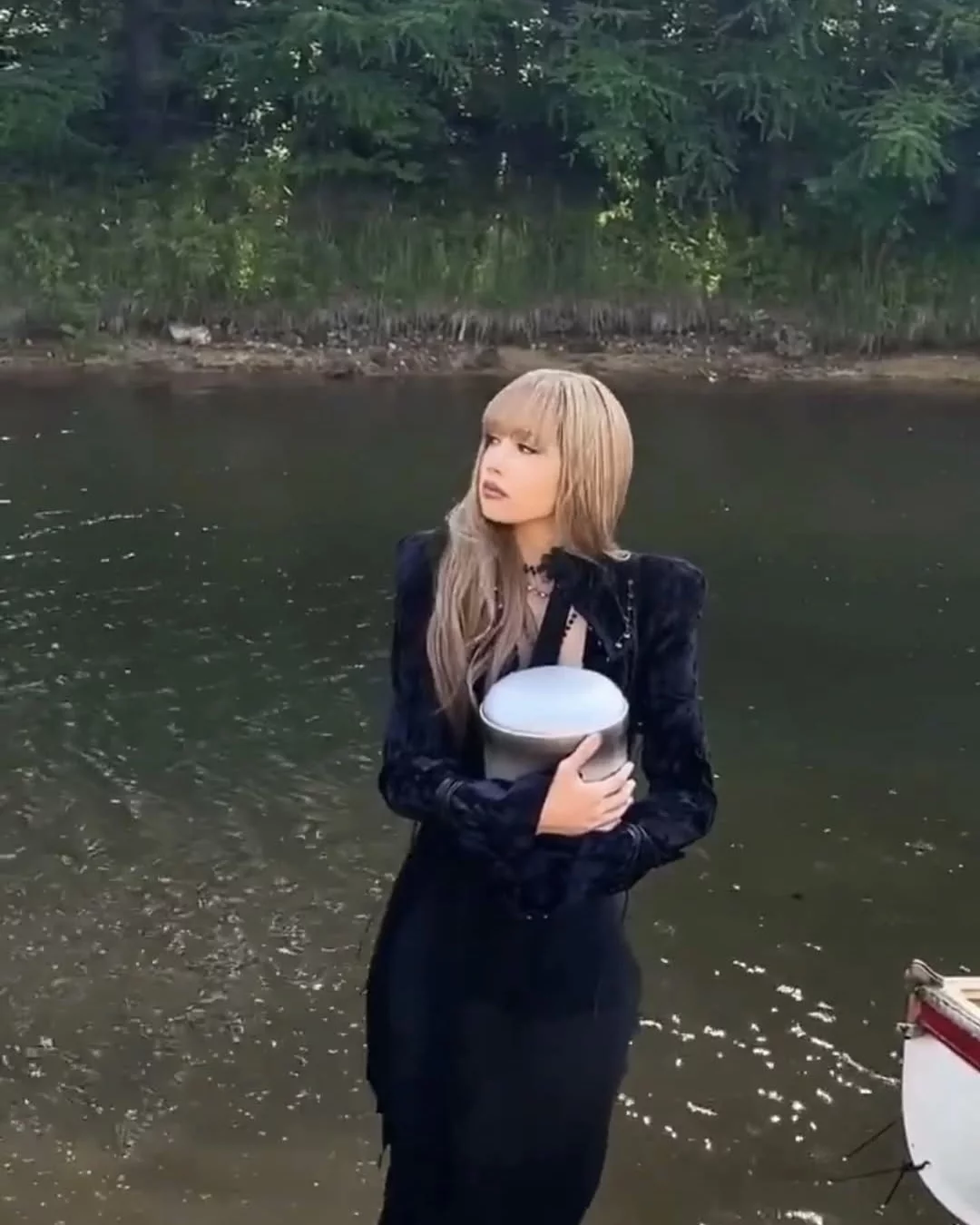 Blackpink Lisa wore a Dilara Findikoglu Fall 2025-inspired velvet jacket and maxi dress in her “Dream” short film music video, which featured her carrying an urn.