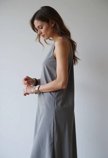 Model in plain gray dress