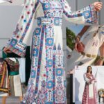 model wearing white and blue cultural outfit