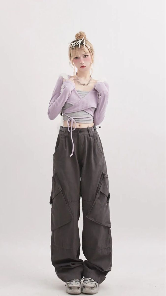 Y2K fashion model in purple crop top and green saggy pants