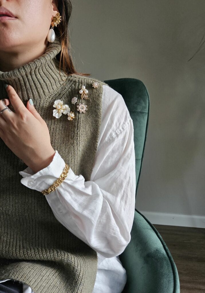 woman wearing many Brooches