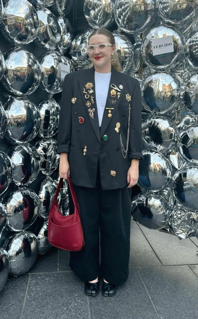 cover image of woman wearing many Brooches