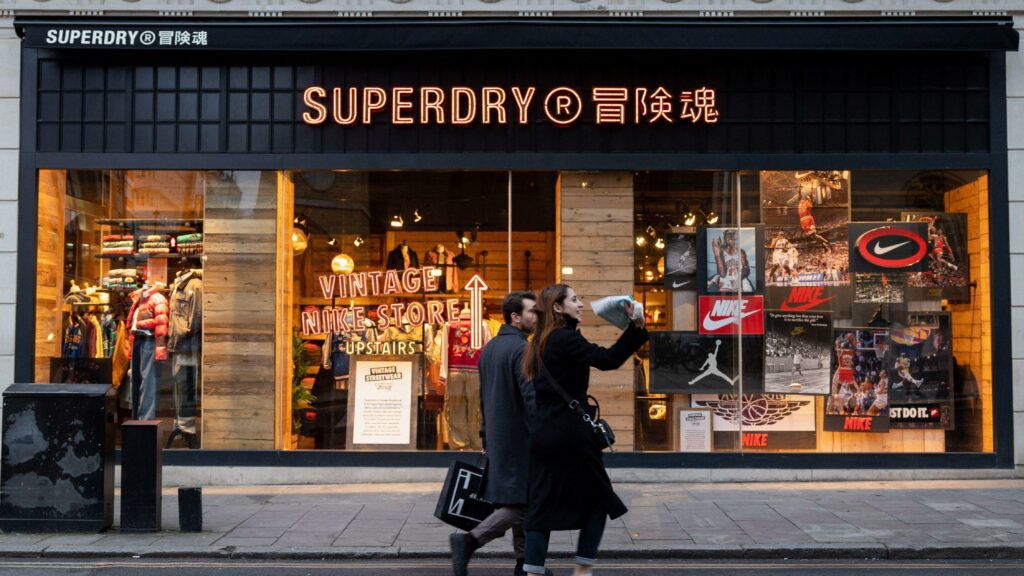 couple in front of Superdry store 
