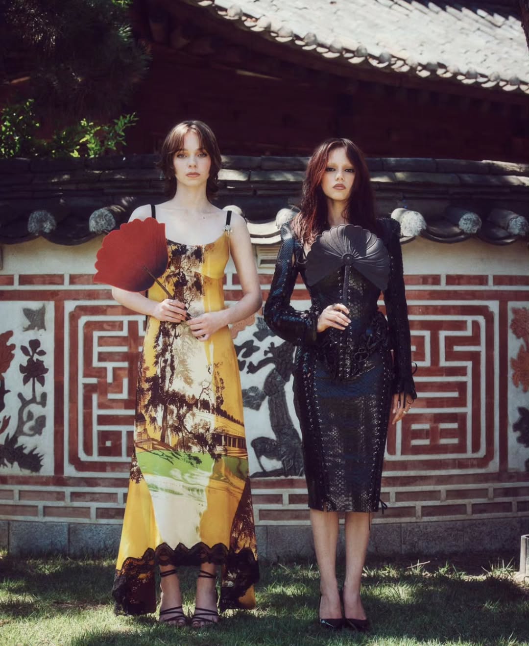 Emma Myers wore a Monse printed slip maxi dress while posing with Jenna Ortega during a photoshoot for the “Wednesday” Season 2 press tour in Seoul.