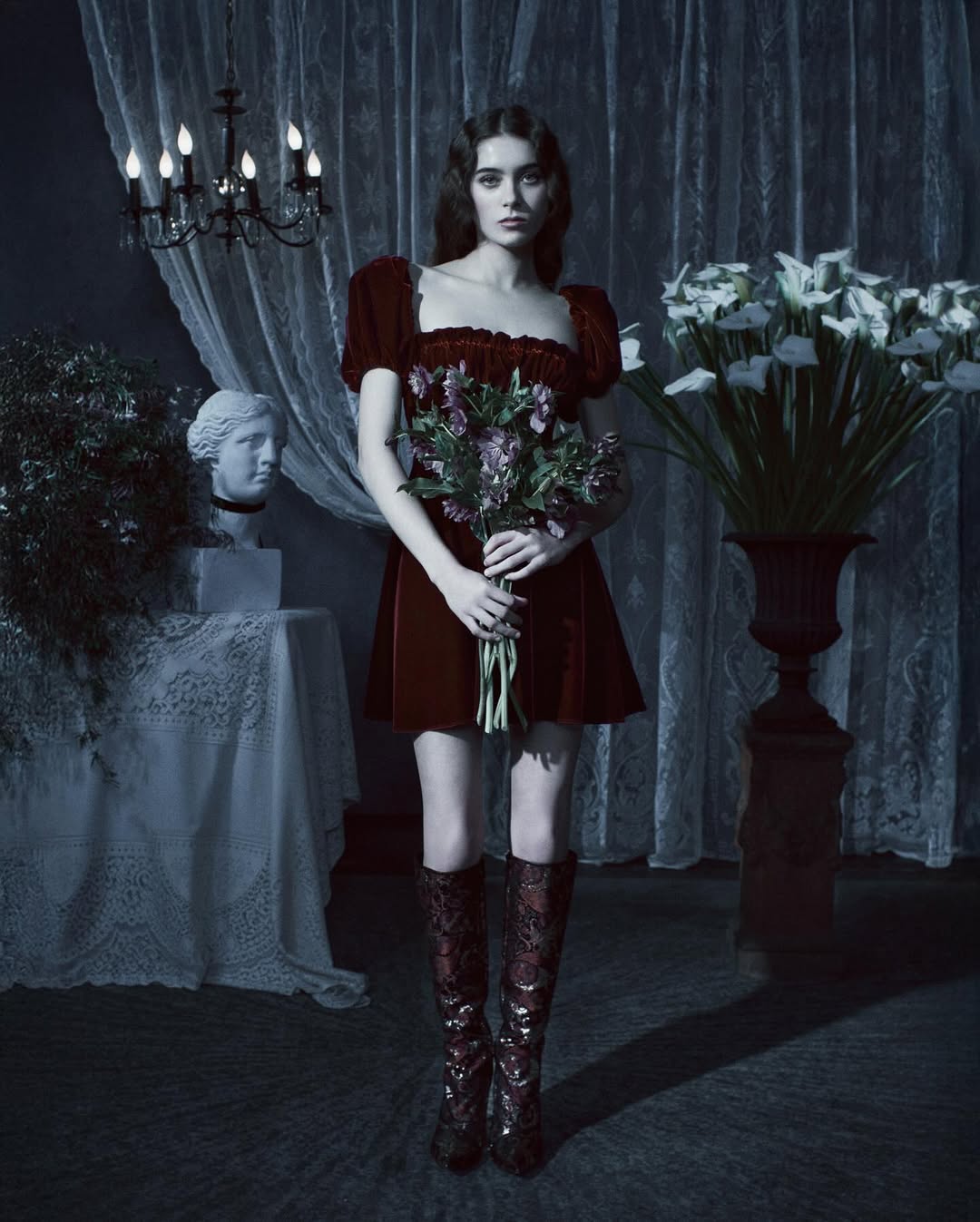 Zola Frank Zappa walks the runway in a burgundy velvet short dress during the Rodarte Fall/Winter 2025/2026 ready-to-wear collection fashion show.