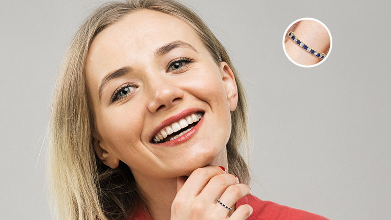 woman wearing a sapphire eternity band ring