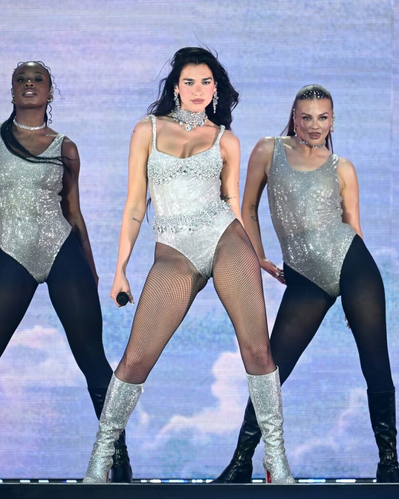 Dua Lipa performed on stage at Wembley Stadium on her Radical Optimism tour with a custom Swarovski bodysuit and knee-high Christian Louboutin boots.