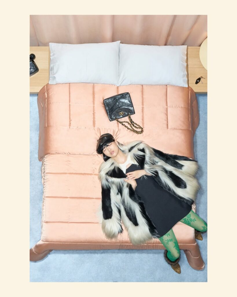 Weiyi Fang models a black and white fur-trimmed coat for the Valentino Resort 2026 collection, which was also worn by Jenna Ortega during the “Wednesday” Season 2, Part 2 Press Tour in Sydney.