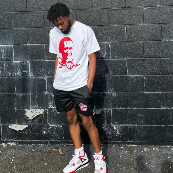 Man wearing Eric Emanuel Shorts and Obama Tee shirt