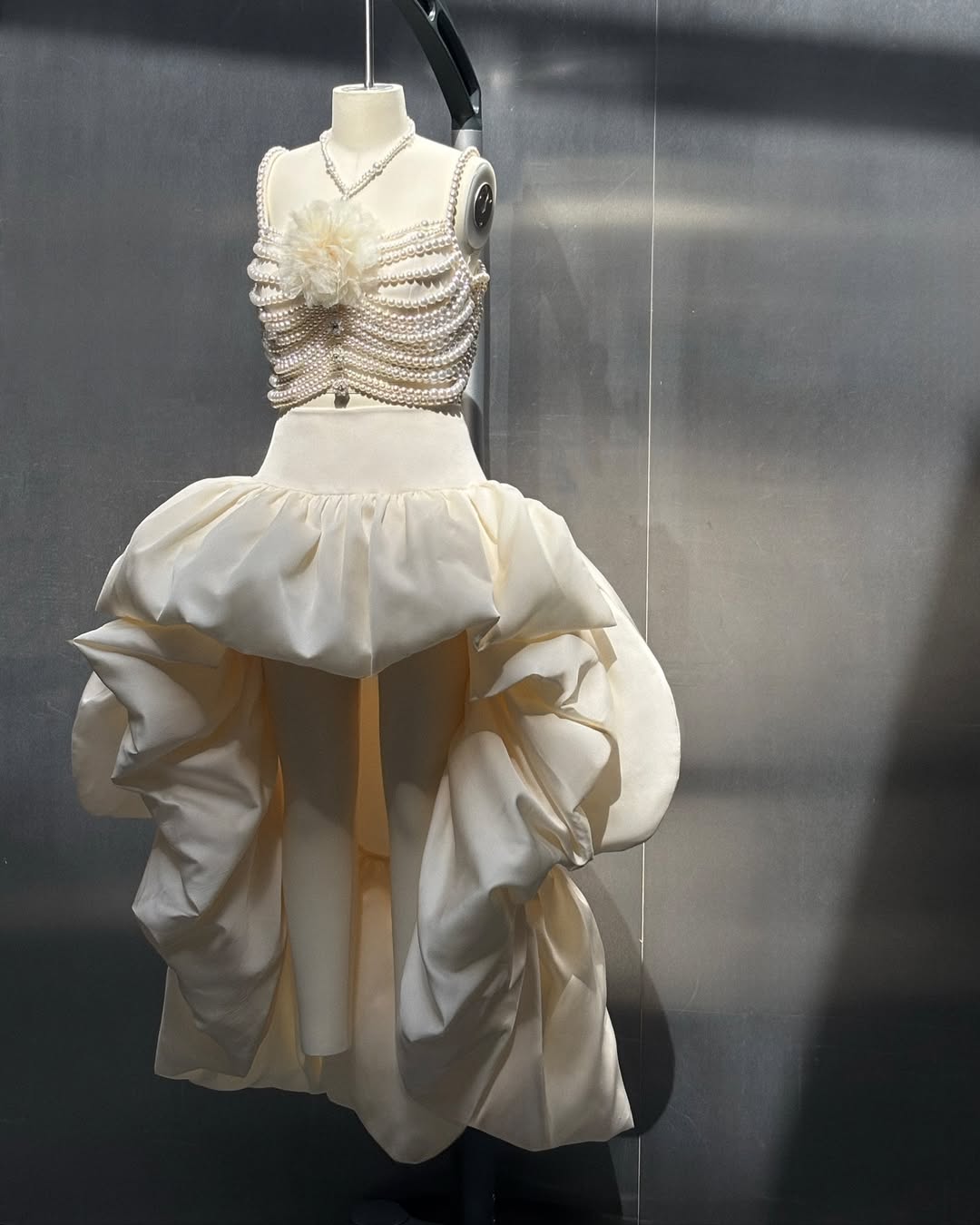 A closer look at the Self-Portrait two-piece pearl-embellished crop top and satin high-low bubble skirt combo for Blackpink Jisoo