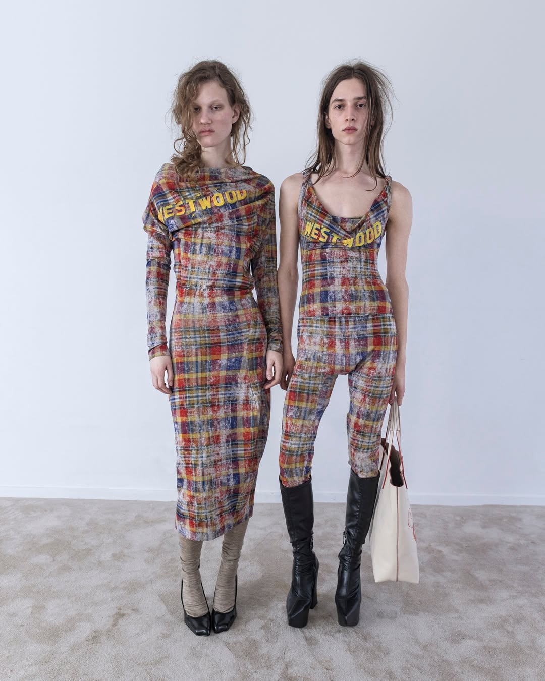 Model Sasha Wodniy wears faded tartan leggings and an Anna top from Vivienne Westwood’s Autumn/Winter 2025/26 ready-to-wear collection.