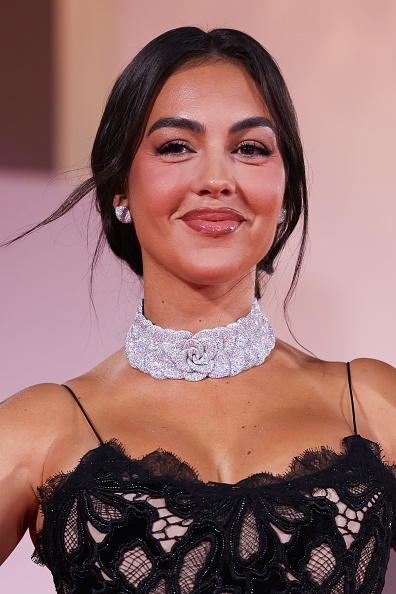 Georgina Rodríguez wore a Roberto Cavalli lace evening gown with a Pasquale Bruni Rosina high jewelry collier in 18k white gold, diamonds, rubies, and pink sapphires.