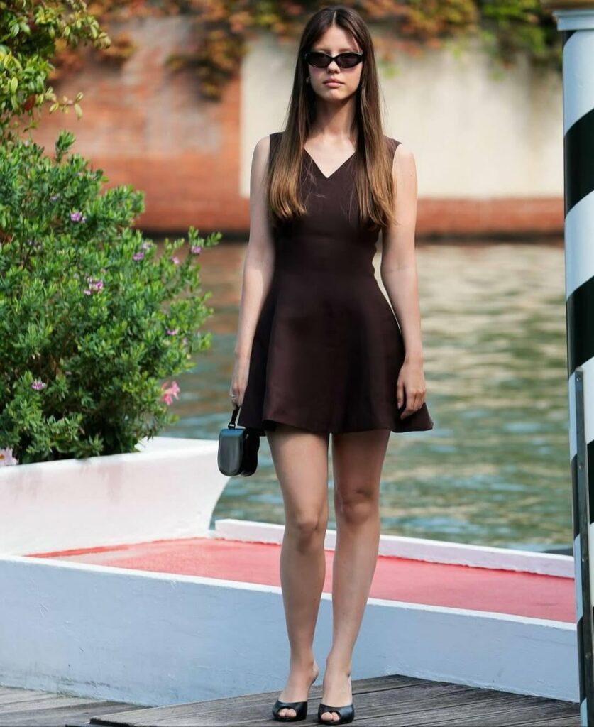 Mia Goth in brown dress