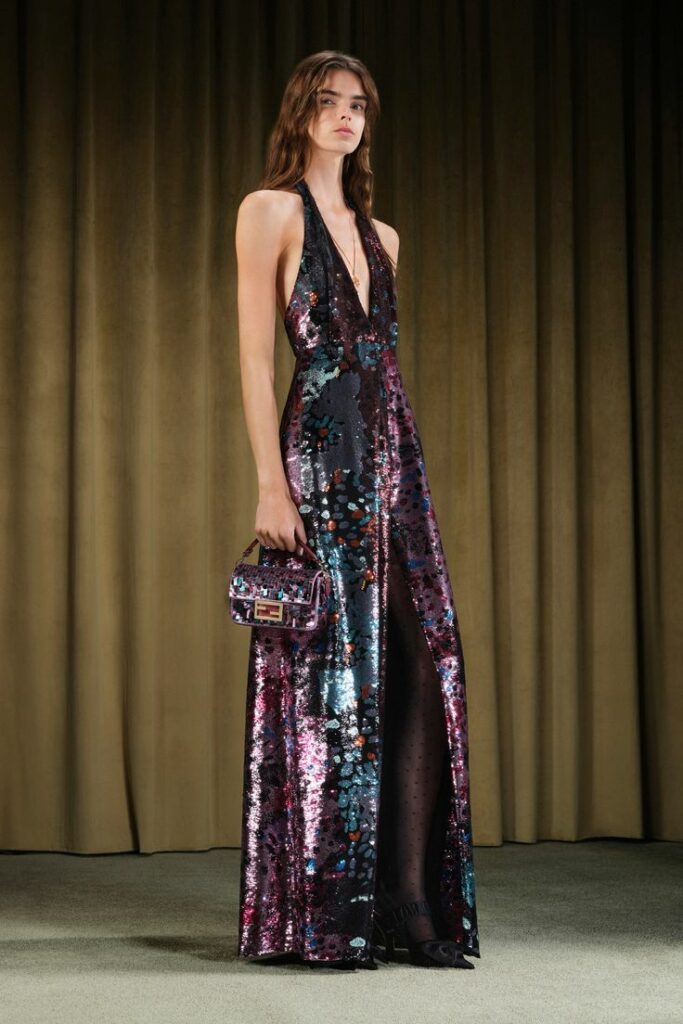 A fashion model models a multicolored sequin evening gown at the Fendi Resort 2026 ready-to-wear collection show