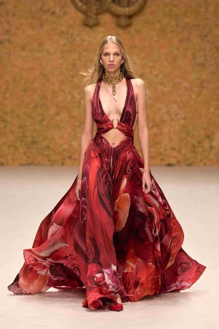 Dubai Fashion Week model in halter type top dress with a peekaboo tummy 