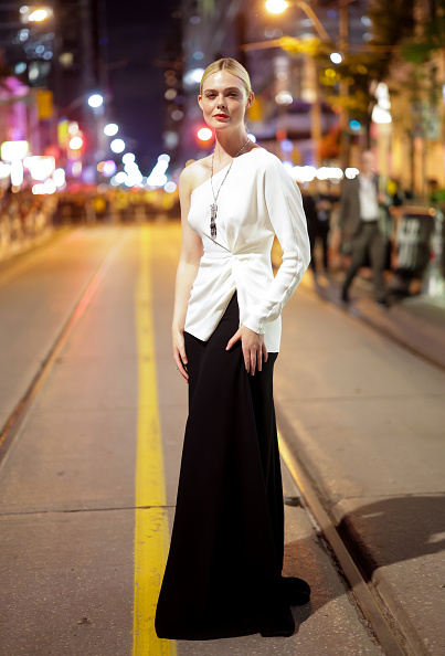 Elle Fanning attends the “Sentimental Value” premiere on the first day of the 2025 Toronto International Film Festival at the Princess of Wales Theatre in Toronto, Ontario, dressed in a black and white Valentino outfit.