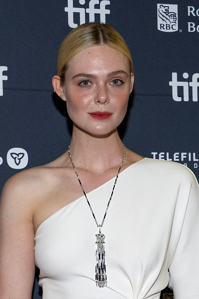 Elle Fanning wore a Valentino one-shoulder blouse and a Cartier Panthère De Cartier necklace to the “Sentimental Value” premiere on the first day of the 2025 Toronto International Film Festival.