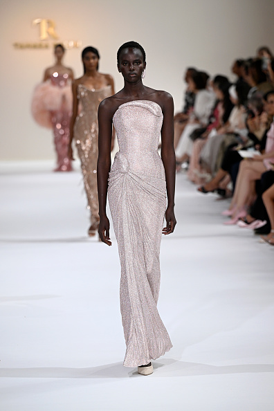 Ajak Dhieu walks the runway during Paris Fashion Week in a strapless silk fine crystal mesh draped gown for Tamara Ralph Haute Couture’s Fall/Winter 2025/2026 presentation titled “La Perle Rare.”