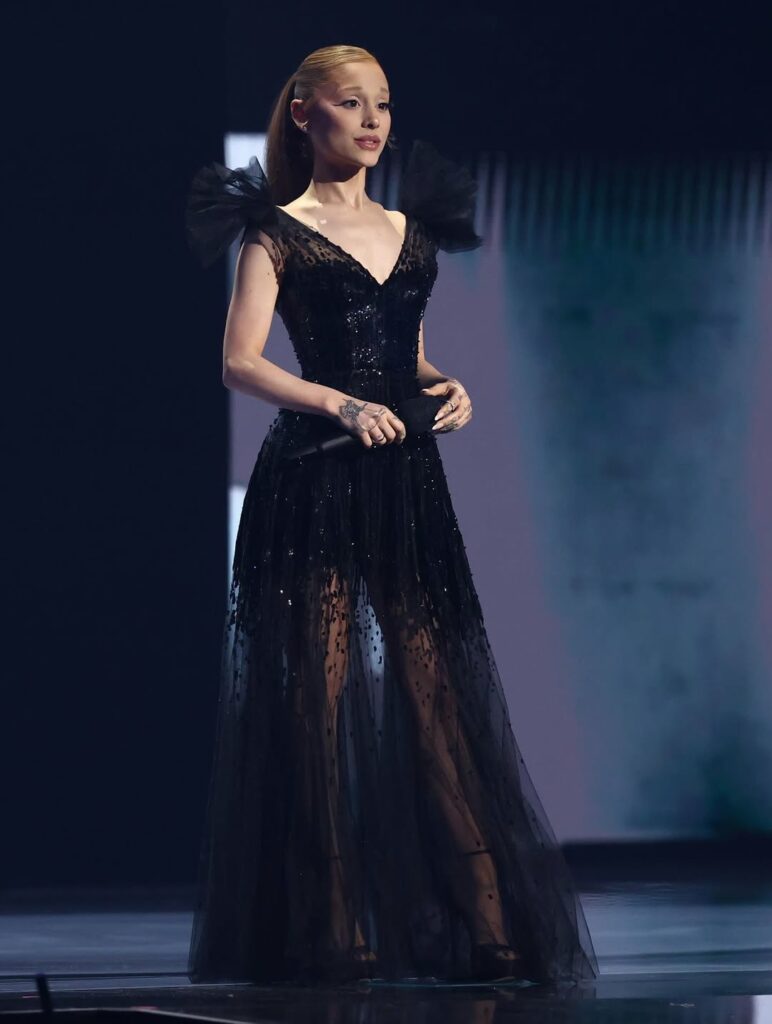 Ariana Grande in black dress on stage at the VMA's 