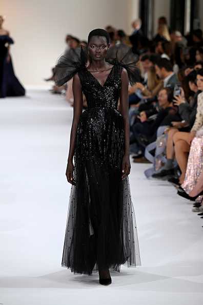 Model wearing the same black dresss Ariana Grande wore at the VMA's 