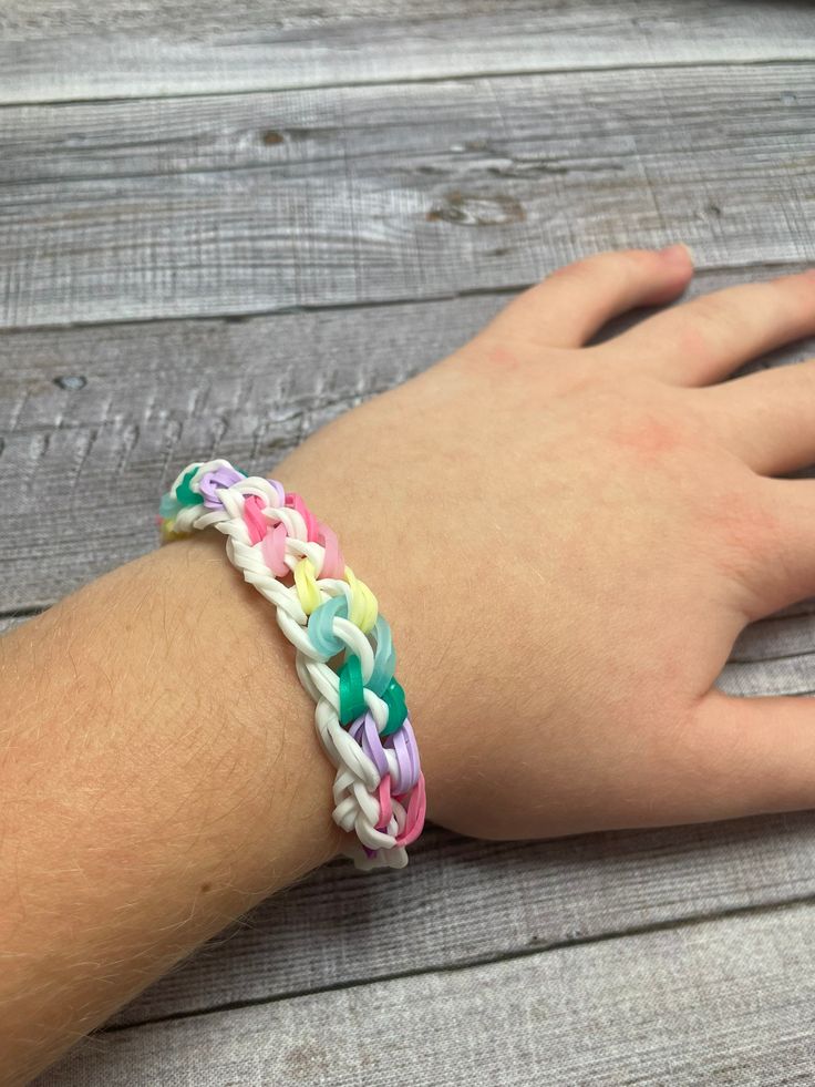 multi colored rubber bracelets on wrist
