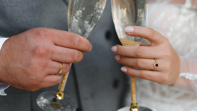 two hands toasting with drinks