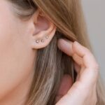 Girls ear with diamond stud earrings