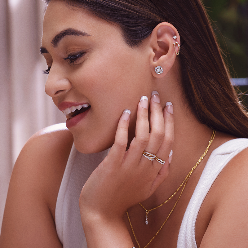 Woman wearing diamond stud earrings