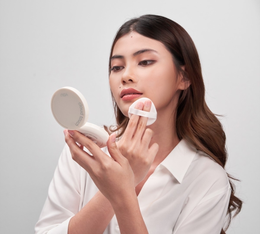 makeup product care and a woman applying makeup to face