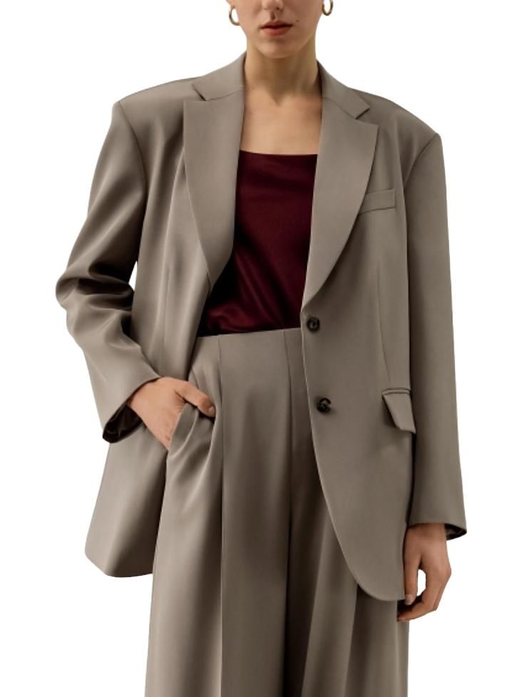 Biege oversized blazer with maroon top and matching biege pants 